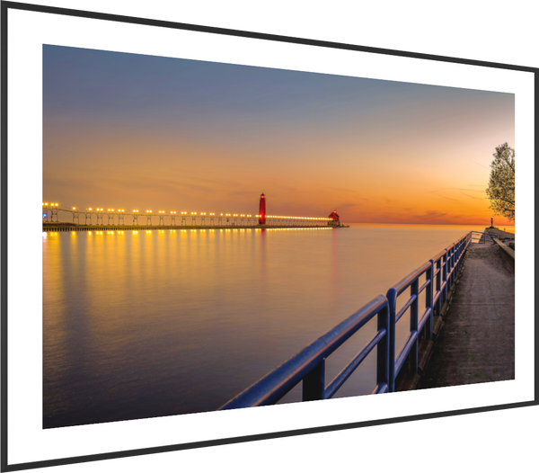 Serene evening view of the Grand Haven channel, showcasing the beauty of "Calm on the Channel" at sunset.