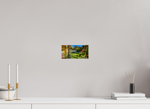 Scenic view at Pebble Beach Golf Links featuring the Champions of Pebble Beach monument and vibrant flowers.