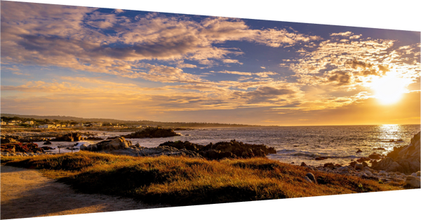 Breathtaking sunset on 17-mile Drive in Pebble Beach, showcasing the stunning coastline and vibrant sky.