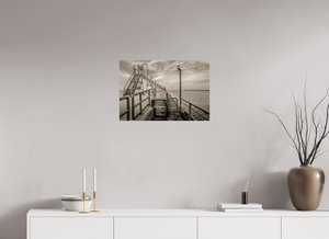 Big Red on the Grand Haven Pier showcases a striking red lighthouse amidst a moody black-and-white scene.