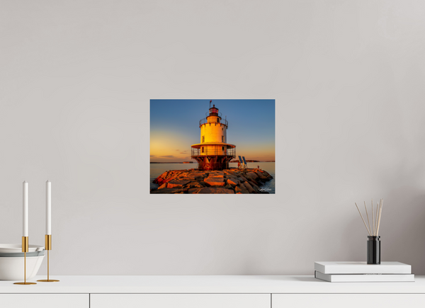 Golden Hour at Spring Point Ledge Lighthouse showcases the stunning sunset illuminating this historic Maine beacon.