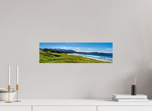 Stunning view of Carmel-by-the-Sea beach, showcasing its beautiful shoreline and lush greenery near Pebble Beach.