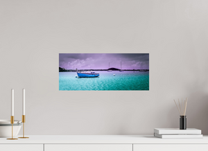 Boats are moored in tranquil waters, showcasing "Aftermath in the Harbor" scene from a Caribbean island.