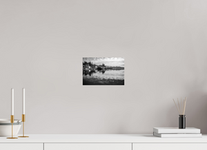 Tranquil black and white scene of Lake Tahoe, featuring serene reflections in "Serenity on the Water – Lake Tahoe in Black and White."