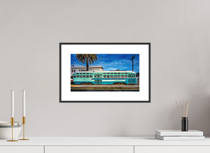Vibrant San Francisco Streetcar parked on the Embarcadero, showcasing the city's iconic transit heritage.