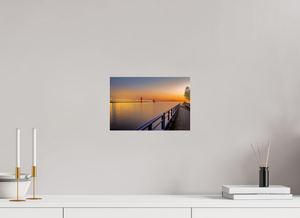 Tranquil sunset over Grand Haven channel, showcasing the beauty of "Calm on the Channel" art piece.