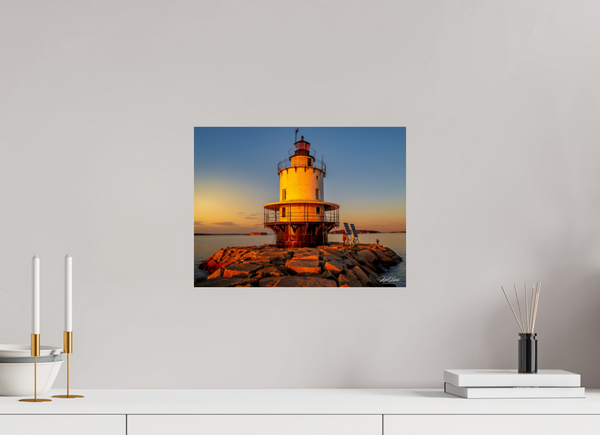 Capture the serene beauty of the Golden Hour at Spring Point Ledge Lighthouse, perfect for coastal decor.