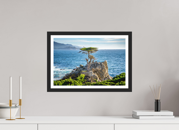 The Lone Cypress stands resilient against the ocean's waves, embodying strength and beauty in nature.