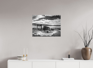 Striking black-and-white photo capturing the Grand Haven Harbor Navigation Project along Michigan's rugged lakeshore.