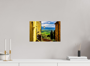 A View from Pienza showcases Tuscany's stunning rolling hills and charming village scenery. Perfect for home decor.