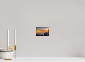 Serene sunset view over the Grand Haven channel, capturing the essence of "Calm on the Channel." Perfect for relaxation.