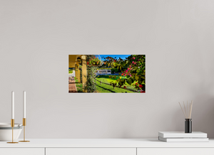 Beautiful view from Pebble Beach Golf Links featuring the Champions of Pebble Beach monument and vibrant flowers.