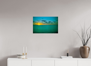 A Caribbean Sunset displays vibrant colors over tranquil waters, perfect for bringing warmth to any space.