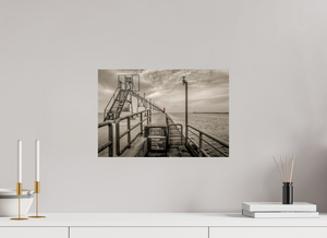 Big Red on the Grand Haven Pier showcases a striking lighthouse in vibrant red against a moody black-and-white backdrop.