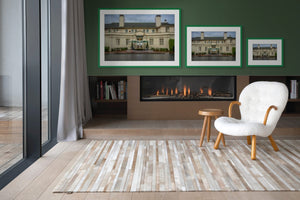 Fine art print showcasing The Lodge at Pebble Beach, capturing its historic beauty in a cozy interior setting.