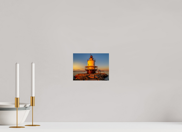 Golden Hour at Spring Point Ledge Lighthouse captures the serene beauty of Maine's iconic lighthouse at sunset.