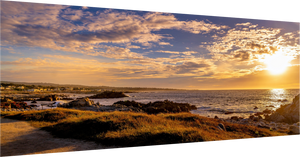 Breathtaking sunset on 17-mile Drive in Pebble Beach, showcasing the stunning coastline and vibrant sky.