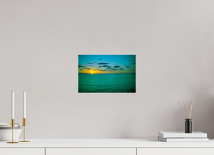 A Caribbean Sunset showcases vibrant hues reflecting over tranquil waters, perfect for your home decor.