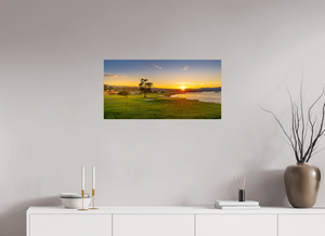 Breathtaking view of No. 18 at Pebble Beach, capturing sunrise over the iconic golf course in vibrant colors.