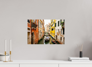 Delivery Enroute captures a scenic canal view in Venice, Italy, showcasing vibrant buildings and serene waters.