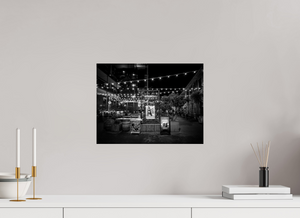 Black and white photo showcasing the enchanting San Francisco Nights – Ghirardelli Square, illuminated by string lights.
