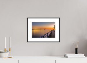 Serene sunset view of the Grand Haven channel, perfect for adding a touch of tranquility with "Calm on the Channel."