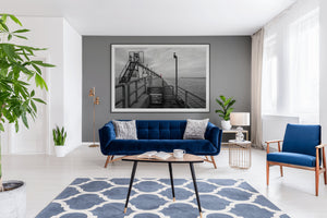 Big Red on the Grand Haven Pier showcases a striking red lighthouse amid a moody black and white coastal scene.