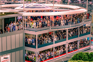 Elegant guests gather in the VIP at Monaco GP hospitality area, enjoying a stunning view near the start-finish line.