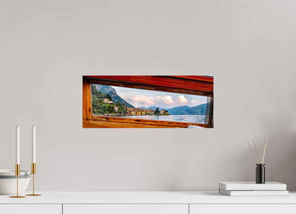 A Window into Lake Como shows a scenic view from a boat, capturing the lake's beauty and surrounding landscapes.