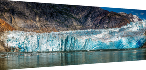 Majestic Sawyer Glacier, Alaska, showcases stunning blue hues and ice formations in Tracy Arm Fjord's breathtaking scenery.