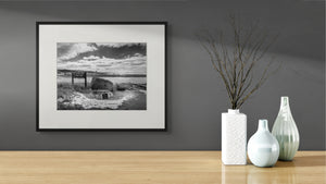 Striking black-and-white photo capturing the Grand Haven Harbor Navigation Project's rugged lakeshore beauty.