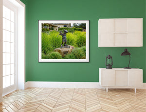 Statue of a boy golfer at Pebble Beach, capturing the spirit of "Just Like Dad" in a vibrant green setting.